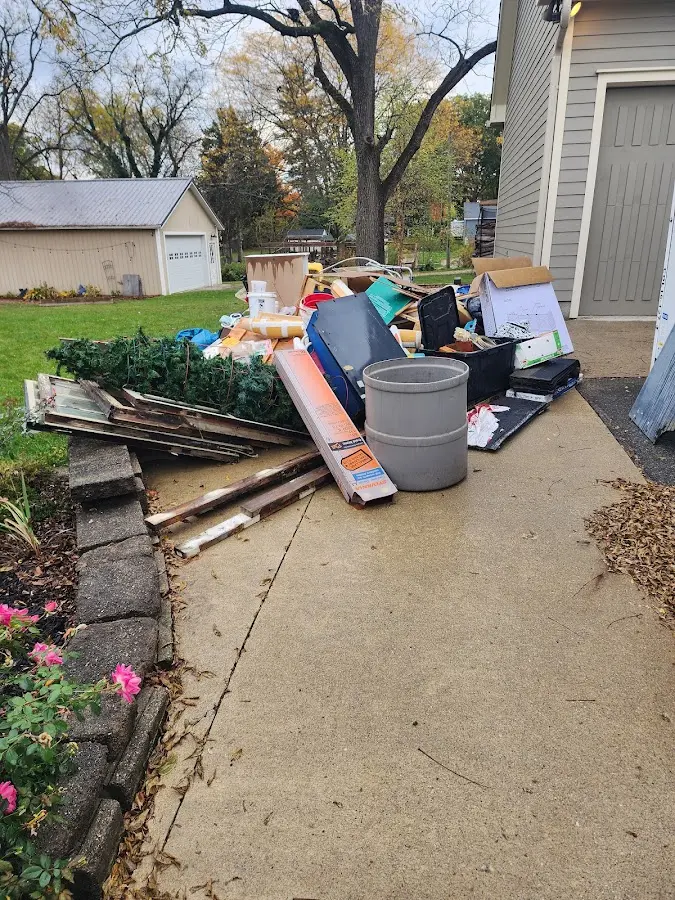 Dumpster being loaded with debris for Commercial Dumpster Rental in Butler